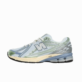 New balance 1906R ice blue melon water running in a cable car station area shoes