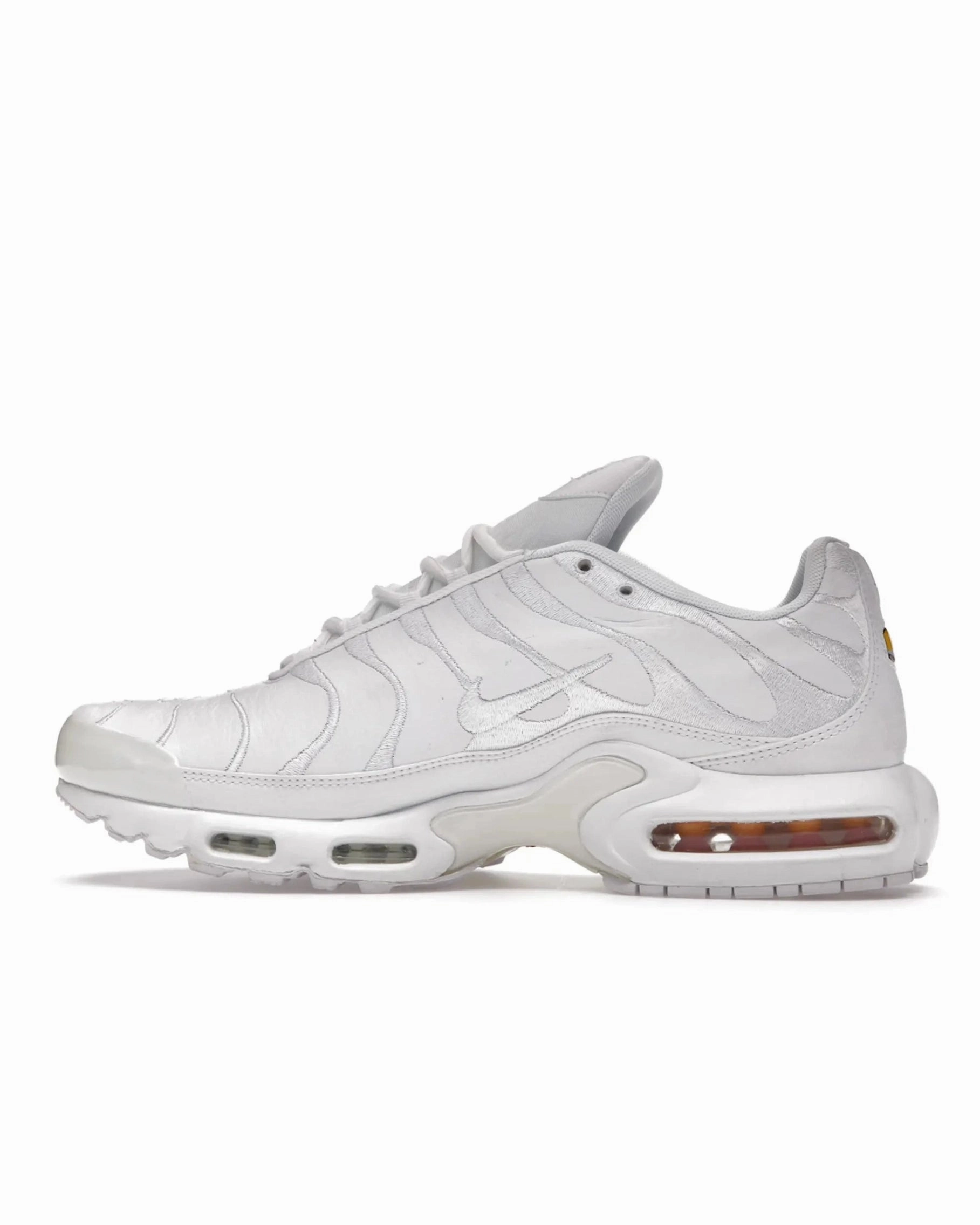 Nike TN Premium Triple White running with a phone anatomical