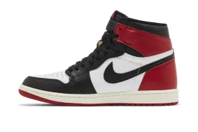 Air Jordan 1 Retro High OG 'Black Toe Reimagined' running in a ditch area shoes